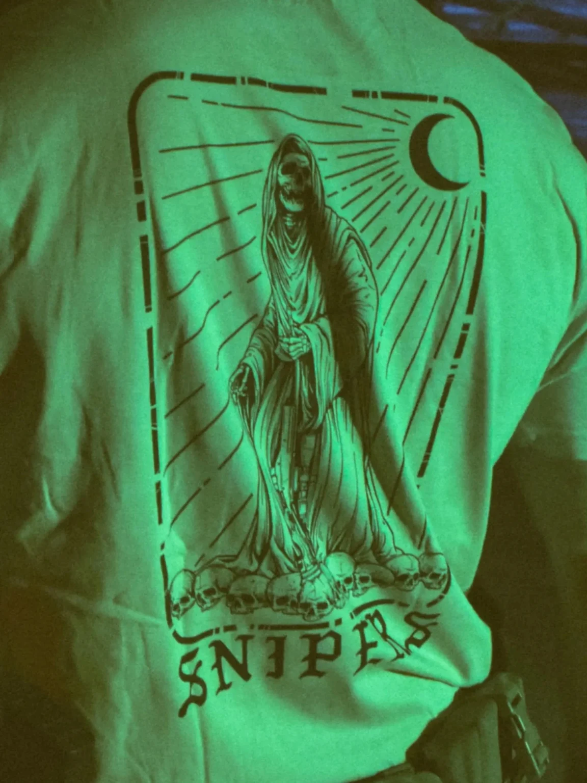 the trace shirt featuring a sniper standing on skulls