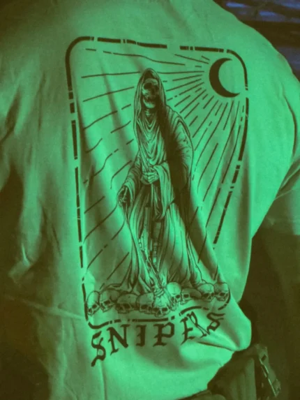 the trace shirt featuring a sniper standing on skulls