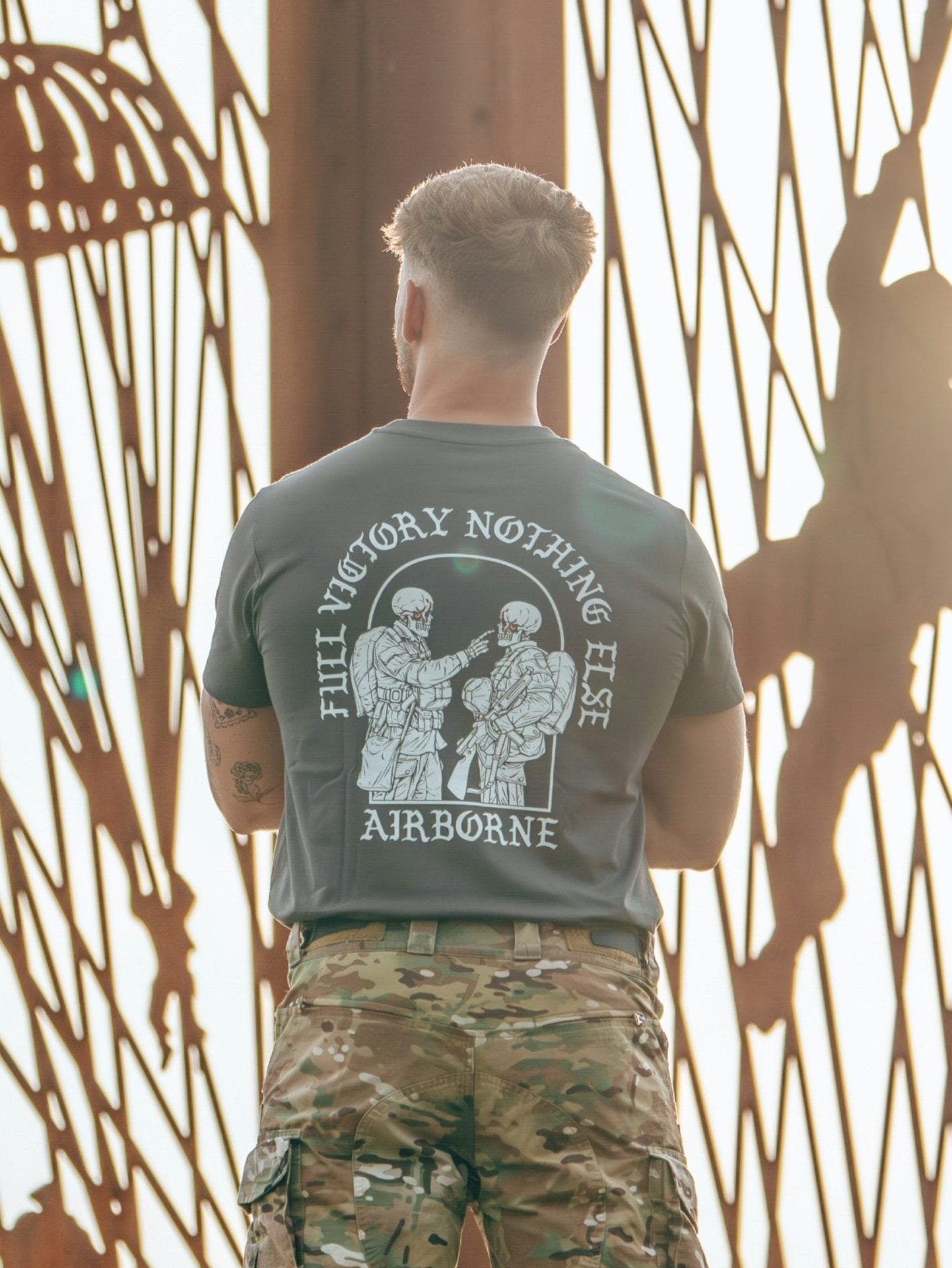 tshirt featuring World War II design of two soldiers standing before a parachute jump