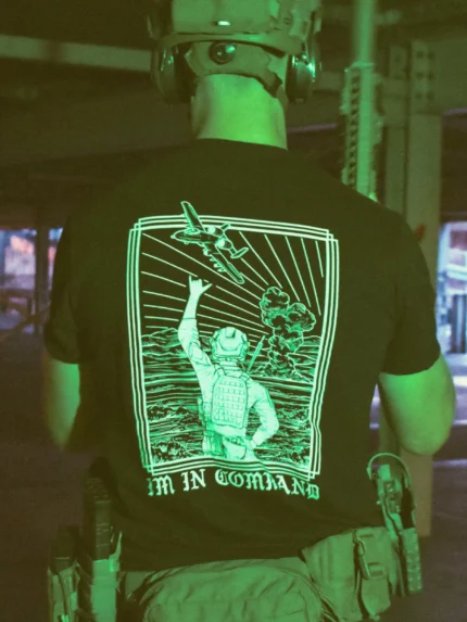 the trace apparel collection featuring a fst jtac guy standing in front of a firing plane