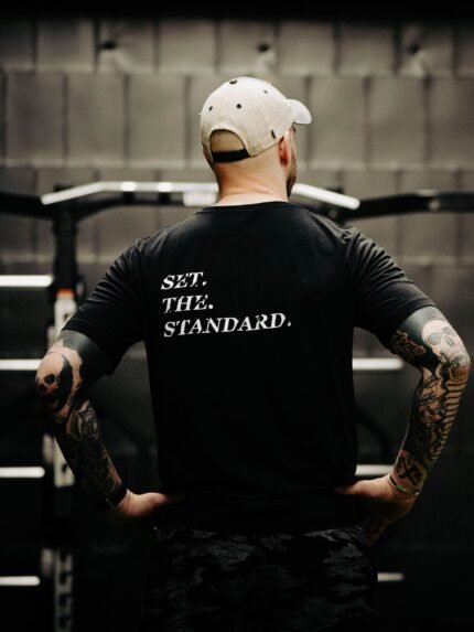 Black T-shirt from The Trace featuring Set the Standard design symbolizing the pursuit of the highest performance