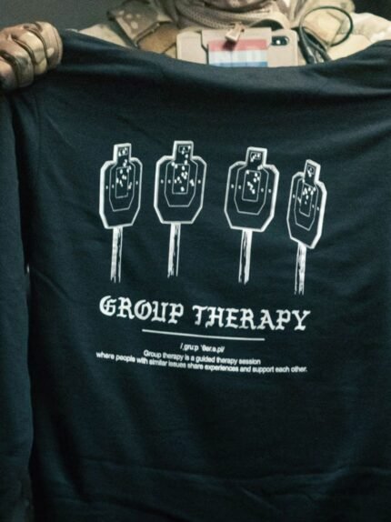 Black hoodie from The Trace featuring Group Therapy design with four targets marked by tight bullet hole groupings