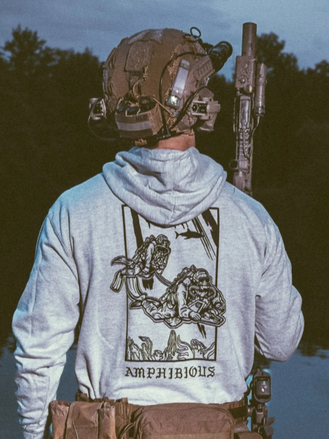 the trace apparel collection featuring two military reconnaissance divers swimming underwater