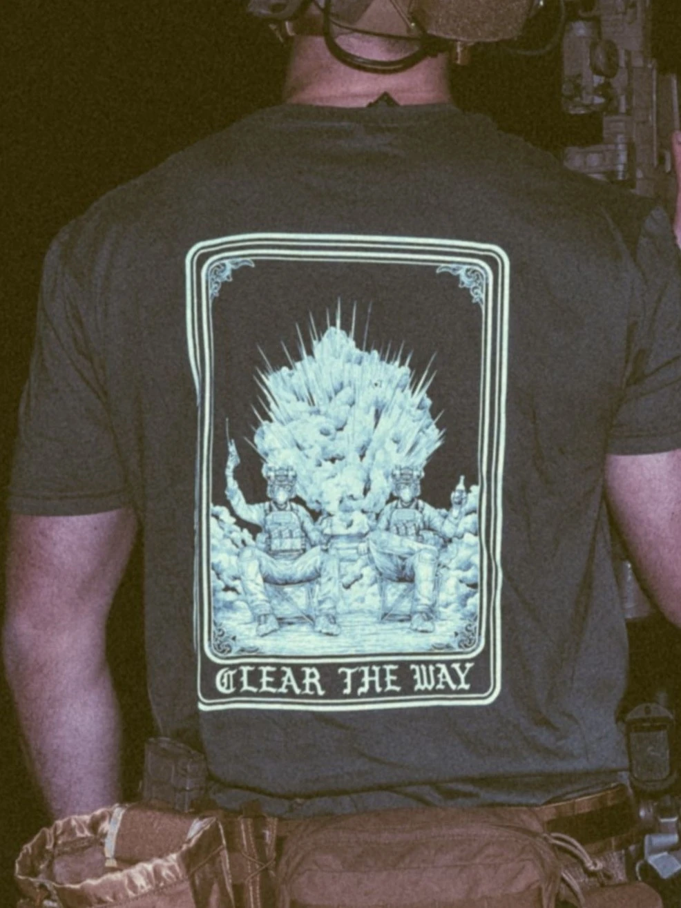 the trace apparel collection with 2 guys sitting in front of a explosing because they are part of the eod