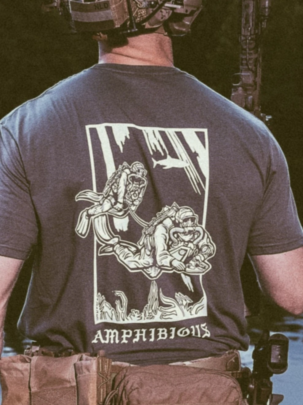 the trace apparel collection featuring two military reconnaissance divers swimming underwater
