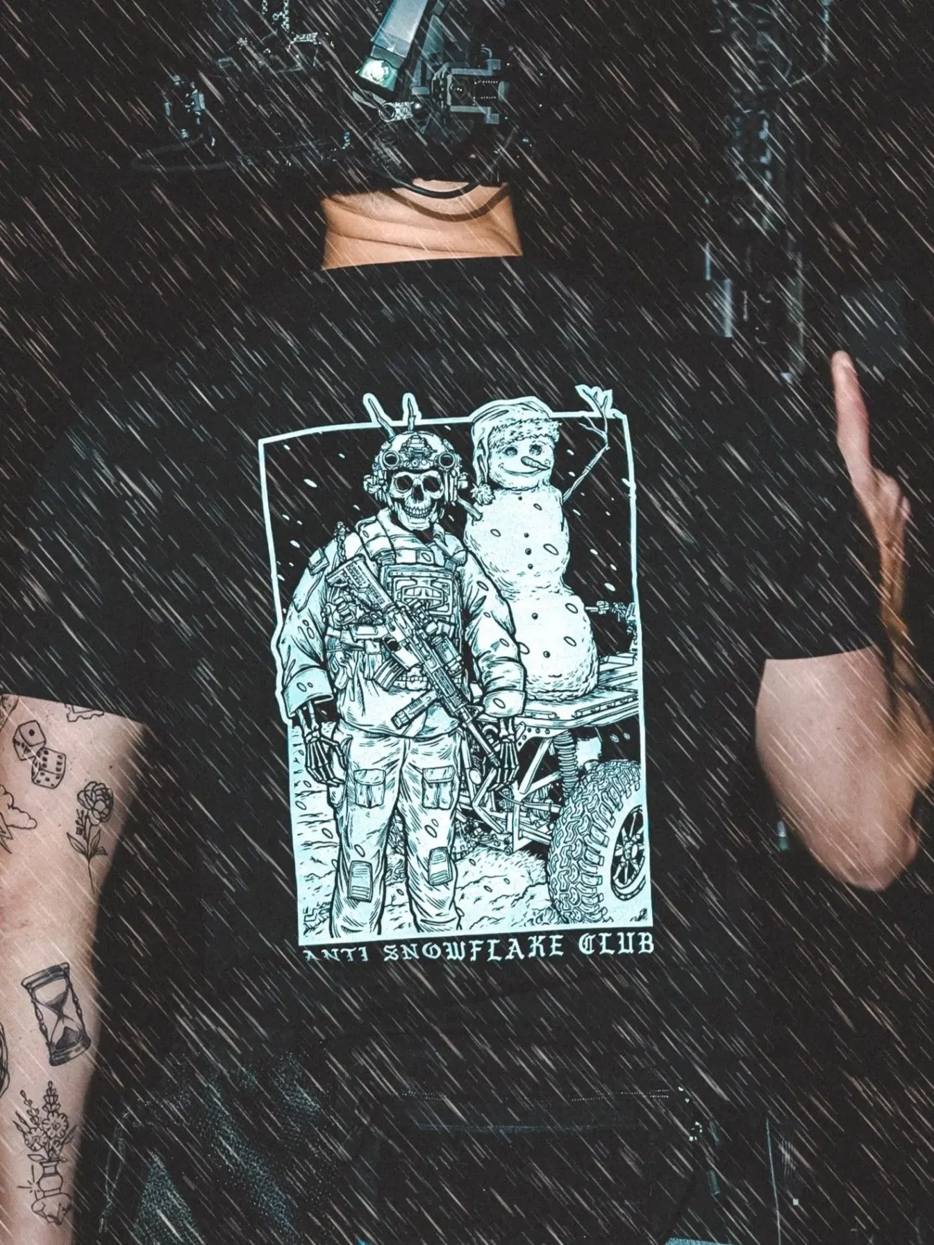 the trace apparel collection featuring a design with a military operator standing next to a snowman with a text saying anti snow flake club