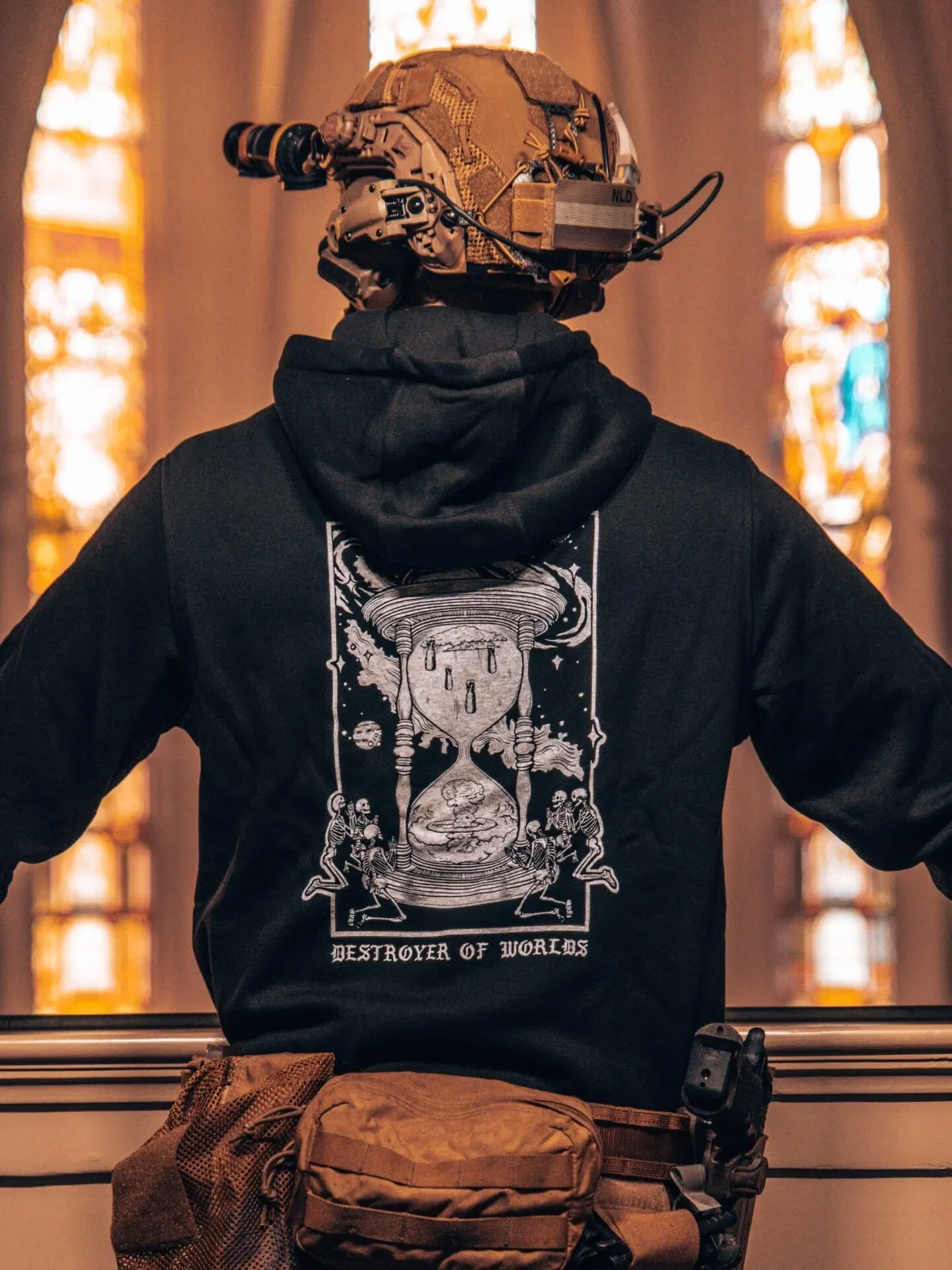 the trace apparel collection featuring skeletons praying to an hourglass showing atomic weapons dropping