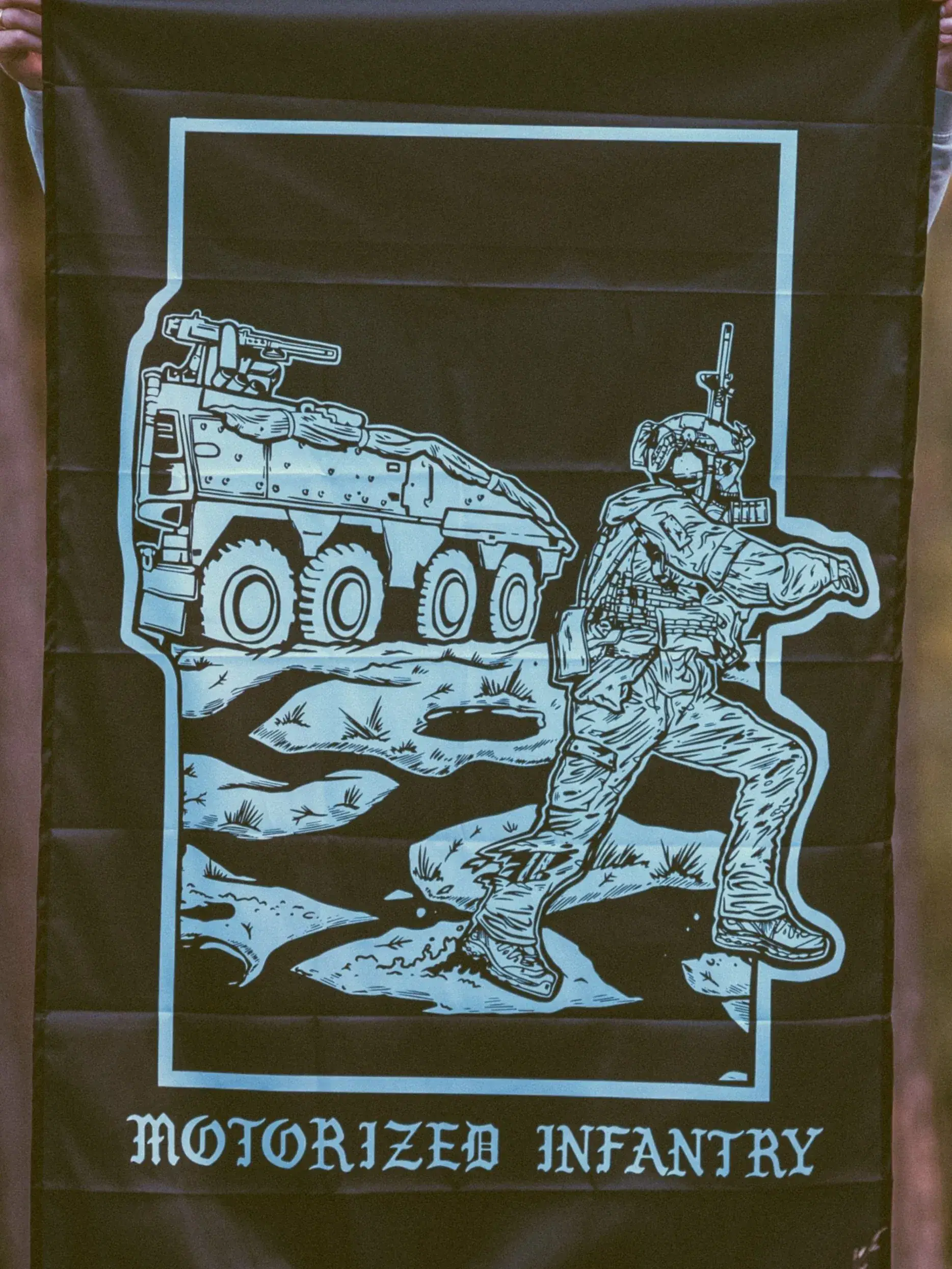 the trace apparel collection featuring guys fighting alongside a military boxer vehicle