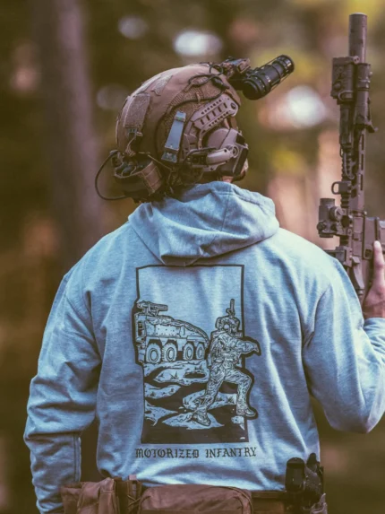 the trace apparel collection featuring guys fighting alongside a military boxer vehicle