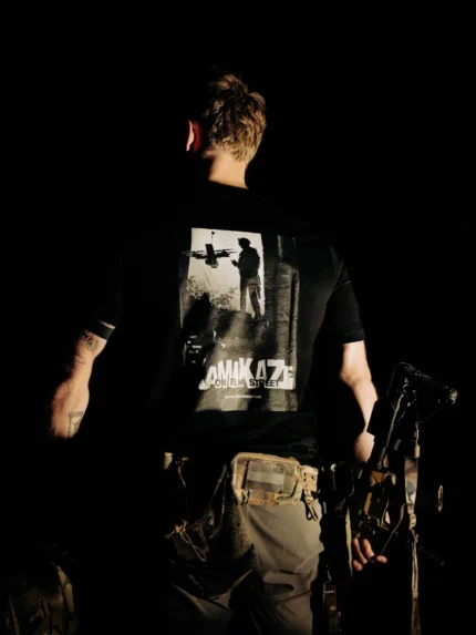 Halloween Kamikaze on Elm Street T-shirt in black by The Trace, back print with a soldier and an FPV drone poster